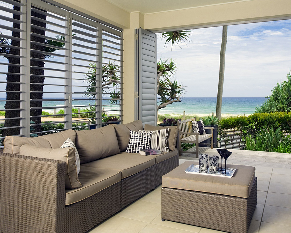 white Aluminum shutters in spacious living area